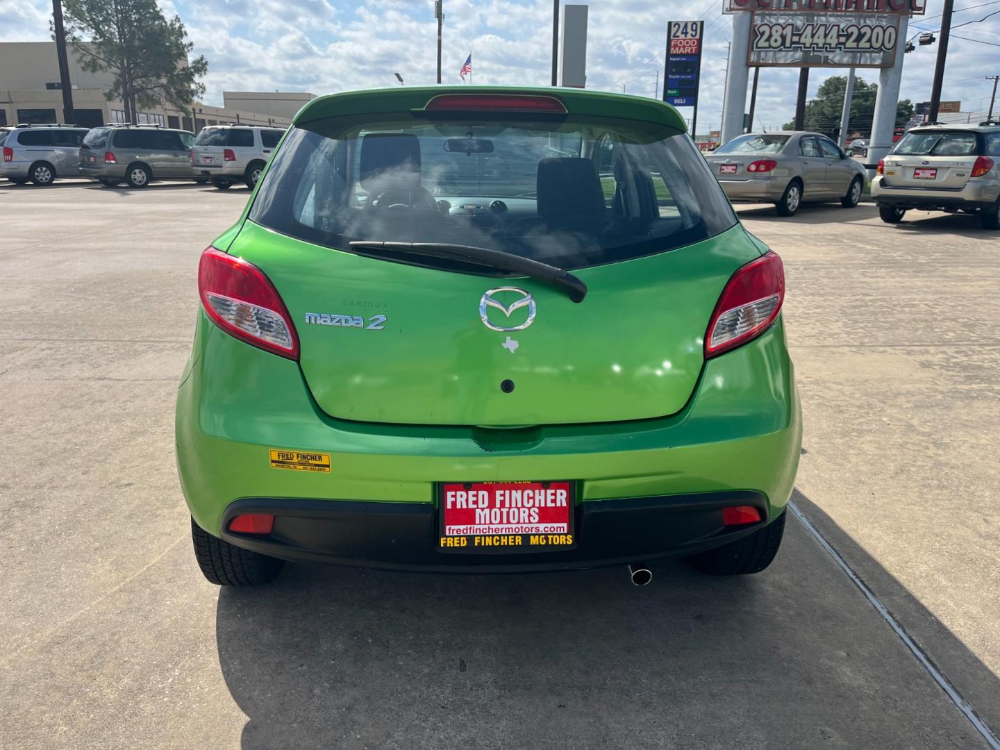 2013 green /black Mazda MAZDA2 Touring (JM1DE1LY1D0) with an 1.5L L4 DOHC 16V engine, Automatic transmission, located at 14700 Tomball Parkway 249, Houston, TX, 77086, (281) 444-2200, 29.928619, -95.504074 - Photo#5